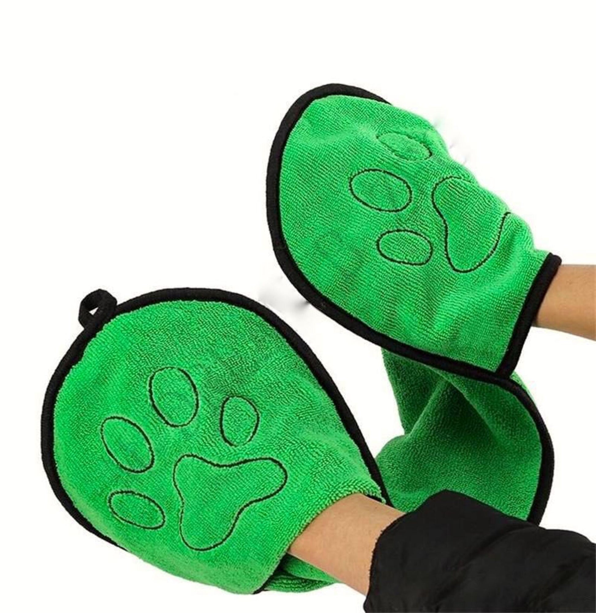 Green mittens with paw design on a white background